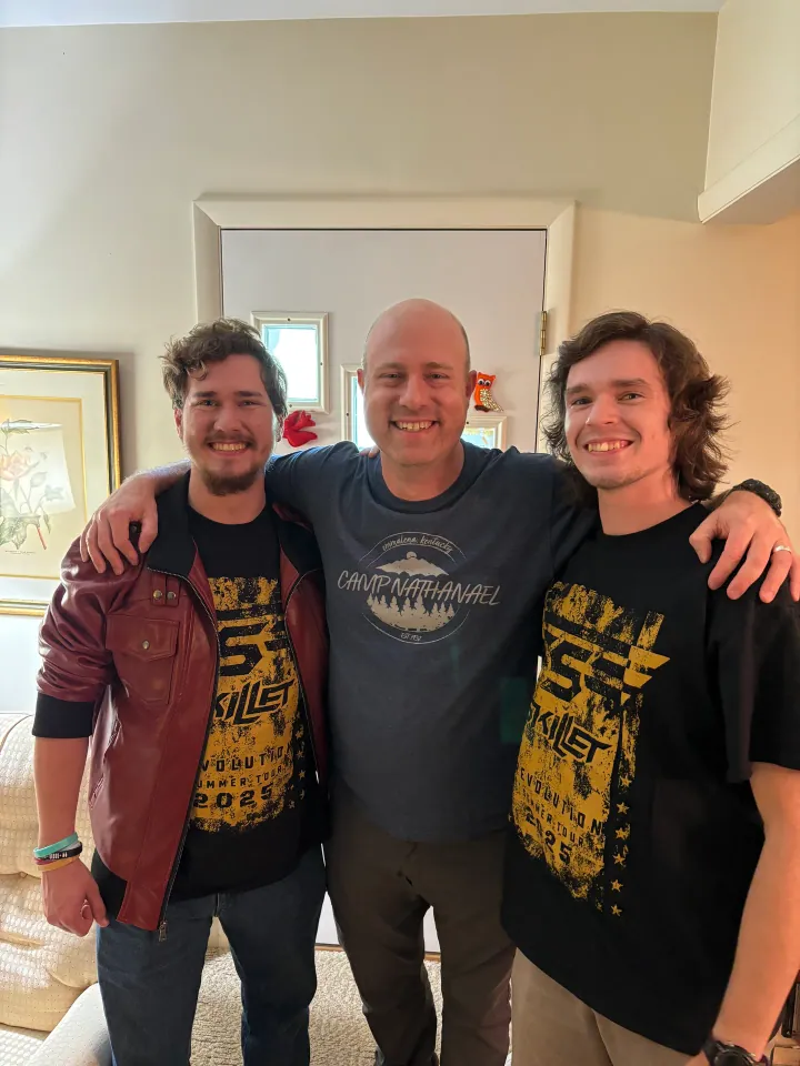 Jon McIntosh, Sam, and Jon Stankus smiling together.