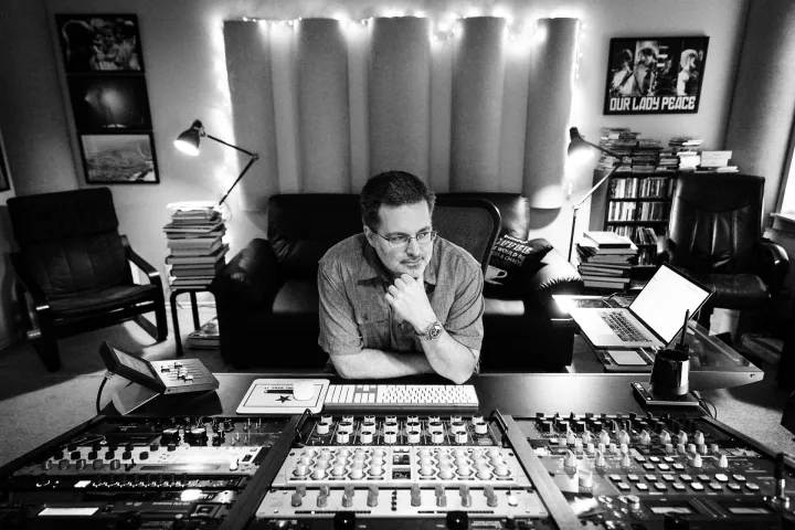 Bob Boyd seated at a mastering console.
